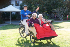 Adrian Boss from BIKEast piloting Sybil Goldberg and Phyllis Glasser from Monterfiore. Photo by Giselle Haber.